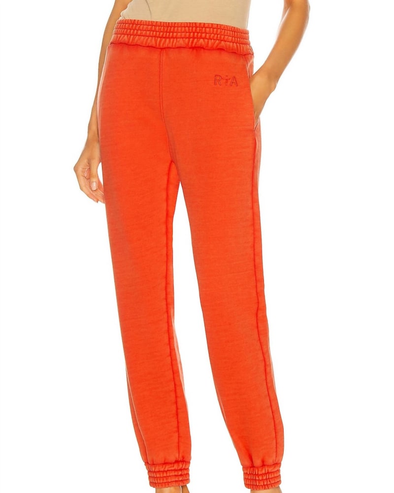 Front of a model wearing a size L Sydney Sweatpant in Faded Orange in Faded Orange by RtA. | dia_product_style_image_id:340487
